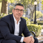 Alan Harrison thinking on a park bench, about to speak.